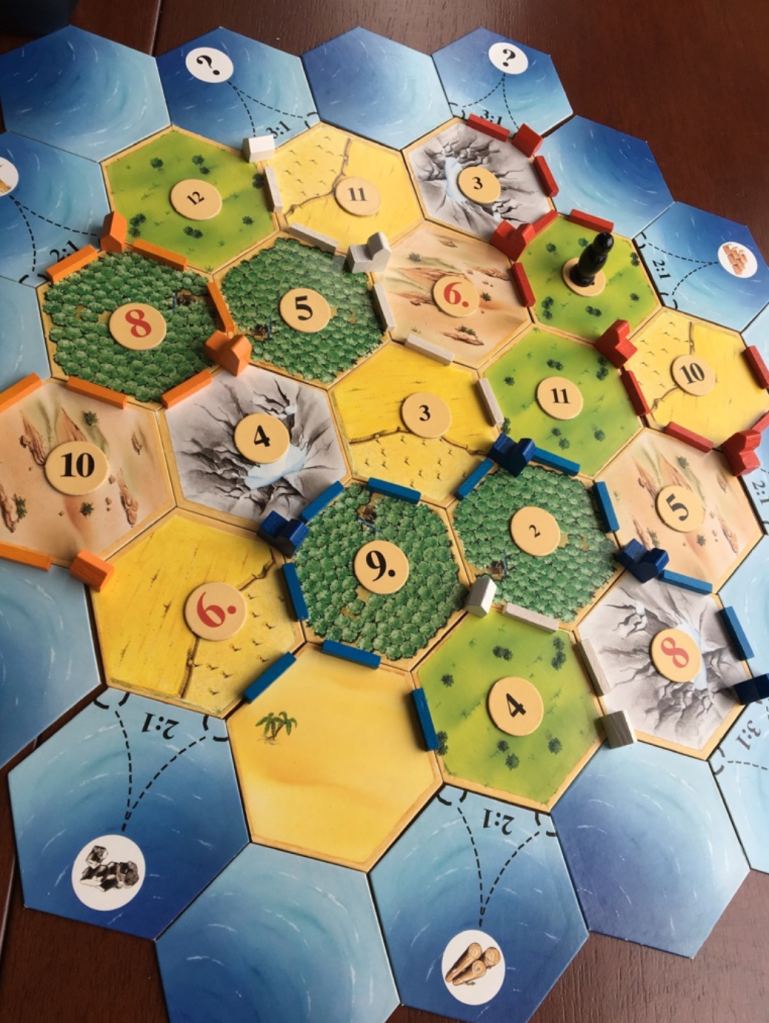 A table top game of Settlers of Catan aka Die Siedler von Catan. Blue (me) has won this game, hooray.